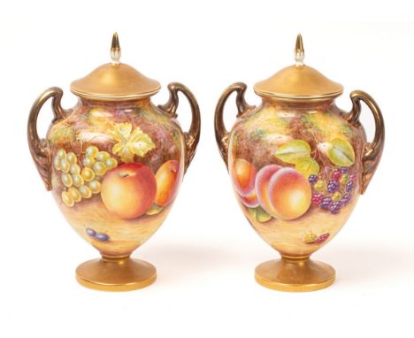 A pair of Royal Worcester two-handled vases and covers painted by Leaman, with peaches, apples, cherries and blackberries, sh