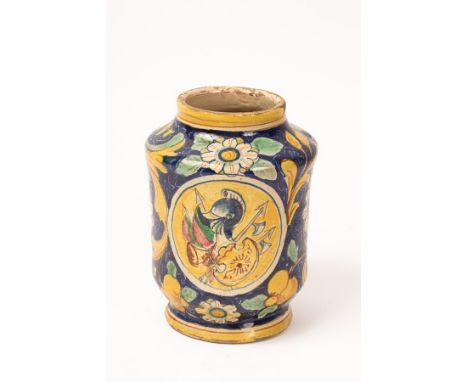 An Italian polychrome maiolica albarello, in the style of 16th Century Venice, with an armorial and trophy roundel to the sid