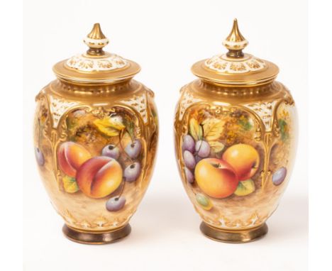 A near pair of Royal Worcester pot-pourri vases and covers, painted with peaches, cherries. apples and grapes, signed, shape 
