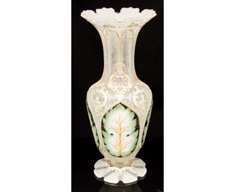 A mid 19th Century Bohemian opaque cased glass baluster vase, circa 1860, ogee flared opening, the body with gothic panels pa