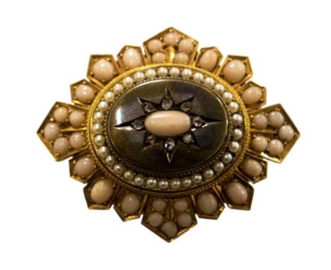 A Victorian coral diamond and seed pearl set oval target brooch 50mm x 30mm, the centre pink coral cabachon with small rose c