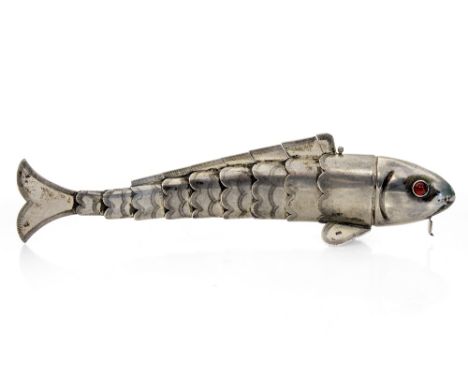 A .935 silver model of an articulated fish, pull-off head, hinged mouth, red glass eyes, struck marks, length 18cm