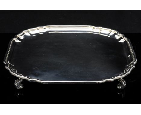 An Elizabeth II silver waiter, ogee octagonal form, on four scroll feet, Roberts and Belk, Sheffield 1968, 23cm diameter, 13.