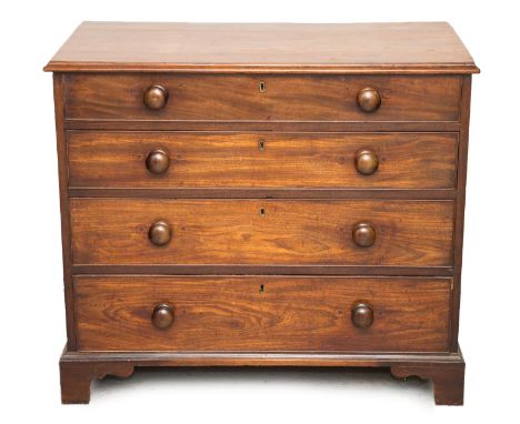 A George III mahogany chest of drawers, comprising four long graduated drawers, fitted with later turned handles, raised on b