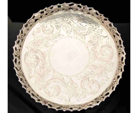 A Continental white metal salver, cast gallery of pierced thorn and rose banding, the centre chased with foliate scroll decor