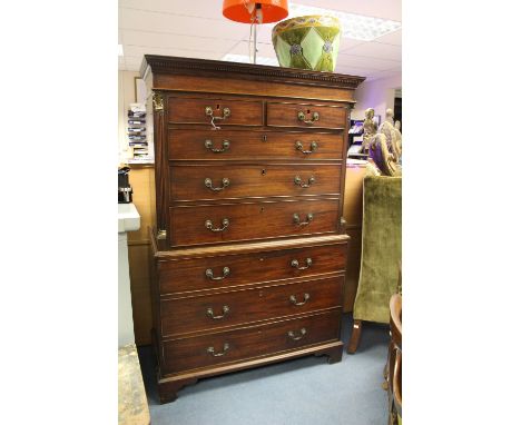 A George III mahogany chest on chest, circa 1780, the upper section with a plain dentil moulded cornice and comprising two sh