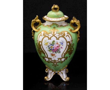 A Royal Crown Derby vase and cover, twin handled ovoid form on four foliate bracket feet, the central oval painted with flora