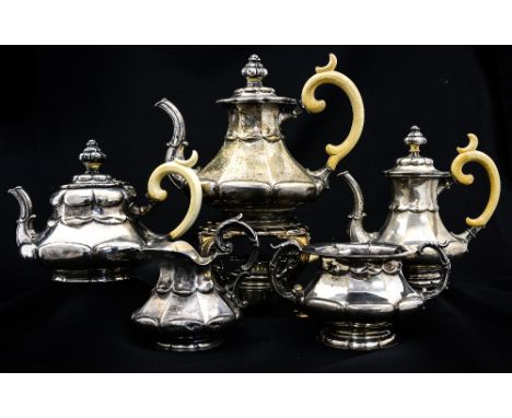 A mid 19th Century German five piece silver teaset, with kettle and burner, faceted baluster form with tongue moulding and ca