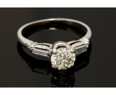A diamond solitaire 18ct white gold ring, the round brilliant cut diamond approximately 0.75 carat, assessed colour J/K, asse