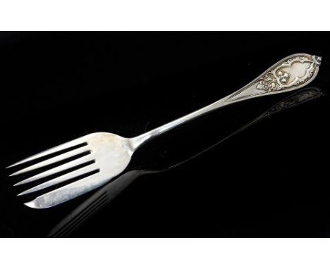 A Victorian silver serving fork, Gothic Revival style handle, George Adams, London 1856, 31cm long, 6.58ozt