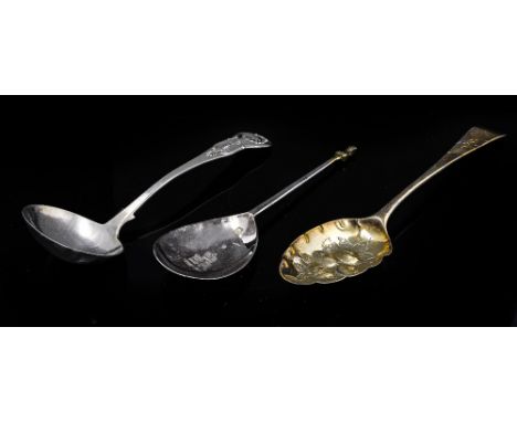 A George III silver dessert spoon, converted to a berry spoon, circa 1762, together with a Scottish Kings Pattern silver sauc