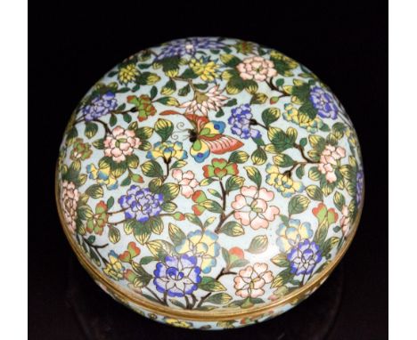 An Oriental cloisonne kogo, decorated with a butterfly amongst flowering blossom on a light blue reserve ground, diameter 12c