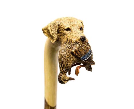 An Ian Taylor hazel walking stick, handle in the form of a labrador's head, retrieving mallard, with certificate.  This is a 