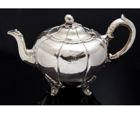 A Victorian silver melon shaped teapot, acorn handle, engraved heraldy within a shaped cartouche, maker William Mann, London 