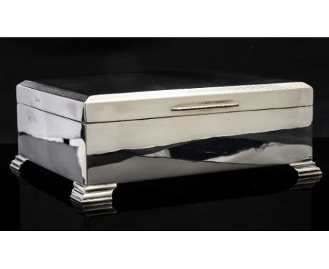 An Elizabeth II silver cigar box, cuboid form on stepped bracket feet, Birmingham 1961, 17.5cm wide, 6.5cm high, 13.5cm deep