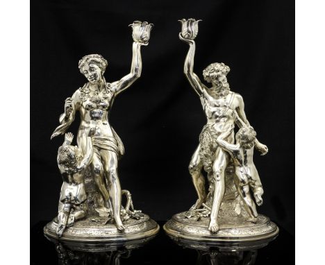 A pair of Victorian cast silver figural candlesticks, modelled as Silenus with the infant Dionysus and Venus with infant, eac