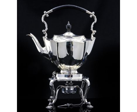 An Edwardian silver tea kettle on stand, Neoclassical fluted shield form, the stand with open strapwork legs and shell feet ,