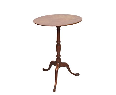 A George III mahogany tilt top tripod table, oval top raised on a turned column, standing on cabriole legs, 69 cm high, 50 cm