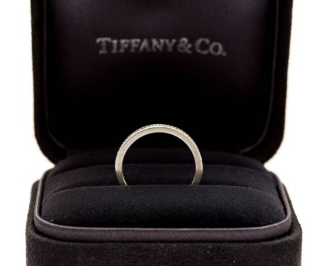 A Tiffany & Co diamond half set platinum wedding band, 2.5mm wide, Tiffany & Co mark to underside shank, ring size K, in orig