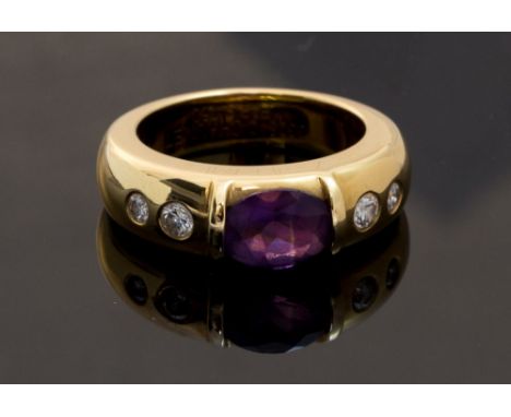 A Chaumet 18ct gold amethyst and diamond set band ring, the centre oval amethyst approximately 1 carat, two small round brill