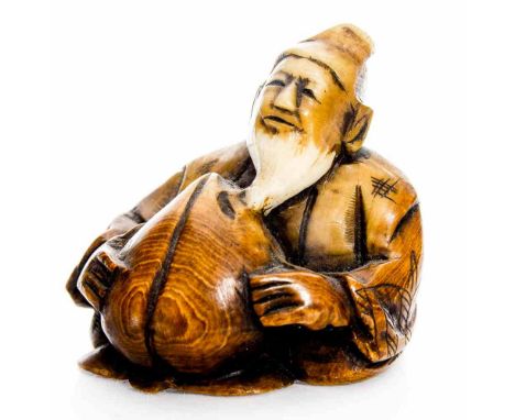 A 19th century Japanese carved ivory netsuke, in the form of an elder holding a peach