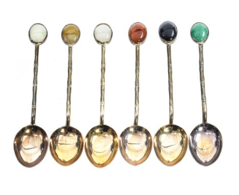 A boxed set of six Sterling silver teaspoons with oval polished cabachon finials 