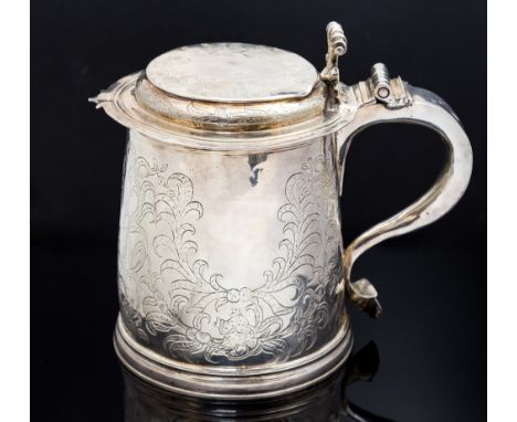 A James II silver lidded tankard, flat top domed hinged cover, scroll thumb piece, scroll handle, the whole thought to be lat