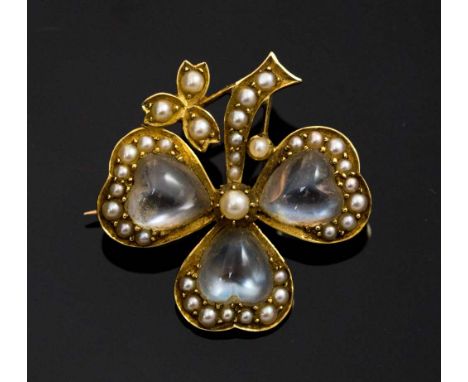 A Victorian moonstone seed pearl yellow metal brooch in the form of a clover, triple heart shaped moonstones with pearl surro