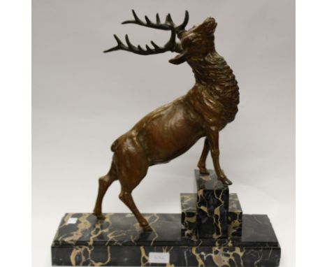 An Art Deco style bronzed spelter model of a stag on marble base (signed Omerth)