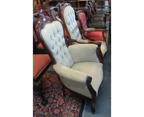 Two Victorian style mahogany framed button back upholstered fireside type armchairs, together with another Victorian style bu