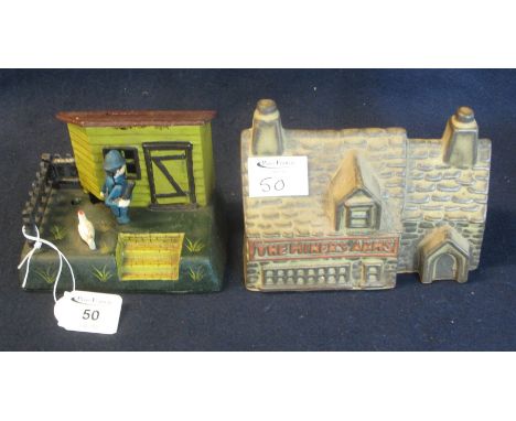 A reproduction cast metal moneybox and a ceramic Miner's Arms stoneware  moneybox. (2)(B.P. 24% incl. VAT) 
