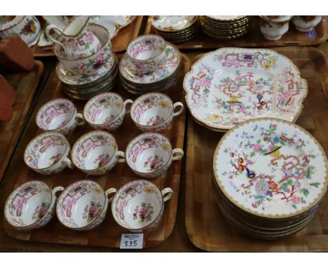 Two trays of Mintons bone china teaware on a white ground with painted oriental decoration comprising; teacups and saucers, m