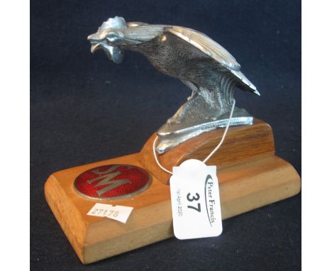 Plated metal 'Bantam' car mascot mounted on a plinth, together with enamel initials plaque 'S.M'. (B.P. 24% incl. VAT) 