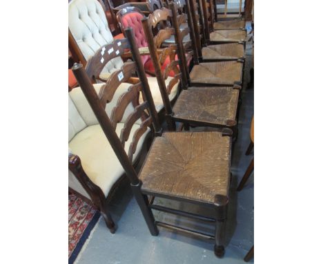 Set of six Lancashire style elm ladder back kitchen chairs with rush seats. (6)(B.P. 24% incl. VAT) 