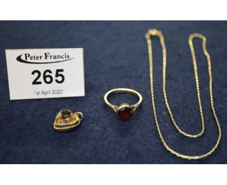 A Victorian citrine heart pendant and a yellow metal garnet set ring, 4.4g approx total weight, together with a gold plated c
