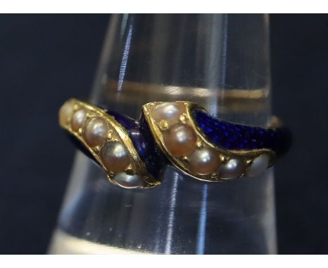 A Victorian mourning ring in blue enamel with seed pearls, with hair locket section to reverse. Unmarked yellow metal, 5.2g a