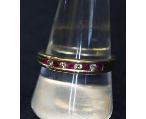 18ct gold, ruby and diamond half eternity style ring. (B.P. 24% incl. VAT)Condition report: Full UK hallmarks. 18ct gold. Als