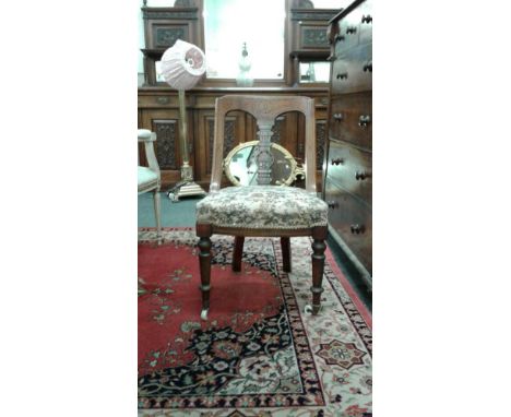 the carved splat backs raised over tapestry upholstered seats, all supported by turned legs