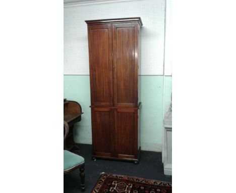 of rectangular form, the upper section enclosed by pair panel doors above a smaller pair in the base, 82 cm wide