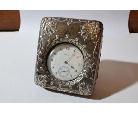 the circular watch with white enamel numbered dial held by an embossed silver frame, Birmingham