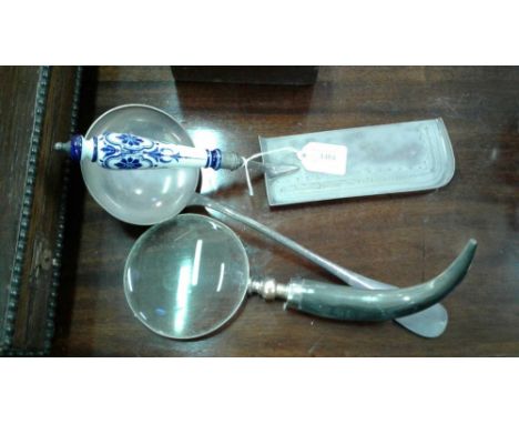 with blue and white porcelain handle, together with a large plated ladle and horn handle magnifying glass