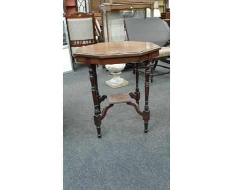 in the traditional taste, the plain moulded&nbsp;top raised on slender turned legs with shelf stretcher, 65 cm wide