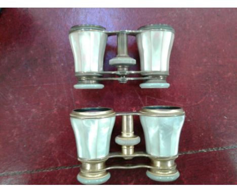 together with another similar pair of mother of pearl and gilt opera glasses, stamped Chancellor &amp; Son, Dublin and Paris,