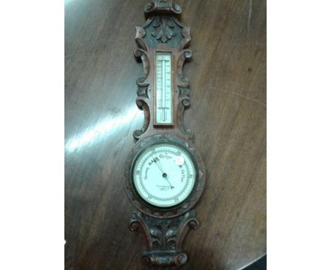 the carved case enclosing a banjo barometer&nbsp;