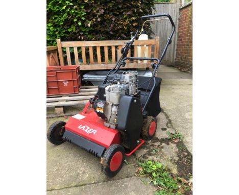 A PETROL SCARRIFIER WITH BRIGGS AND STRATTON ENGINE. 
