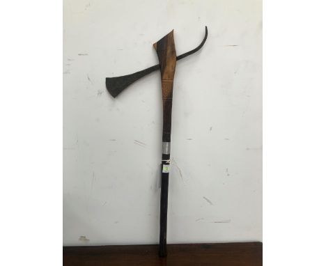 A MODERN AFRICAN CEREMONIAL AXE, THE TOP OF THE HANDLE DICE CARVED AND WOUND WITH WIRE
