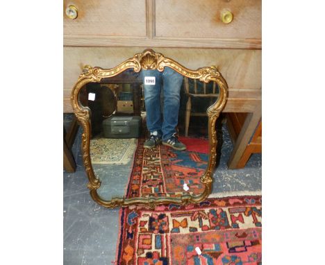 A 20th C. MIRROR IN SCROLLING GILT FOLIATE FRAME.   65 x 49cms.
