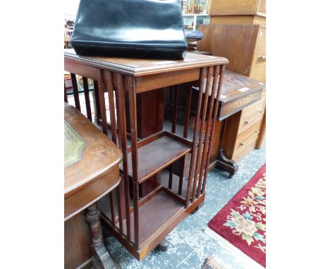 AN EDWARDIAN MAHOGANY ROTARY BOOK CASE