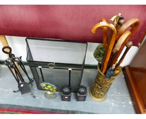 A MESH FIRE GUARD, FIRE IRONS, A PAIR OF LANTERNS WALKING STICKS IN ABRASS STICK STAND