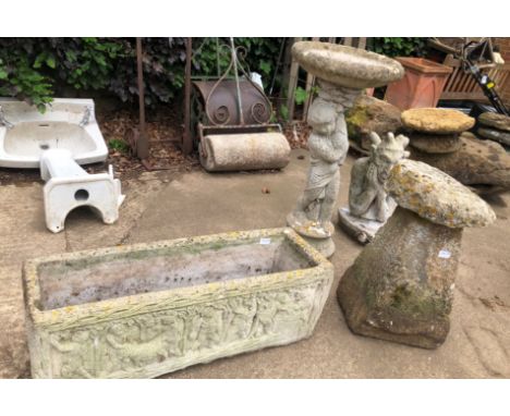 A SMALL ANTIQUE STADDLE STONE TOGETHER WITH A COMPOSITE GARGOYLE, BIRD BATH AND A RECTANGULAR PLANTER.